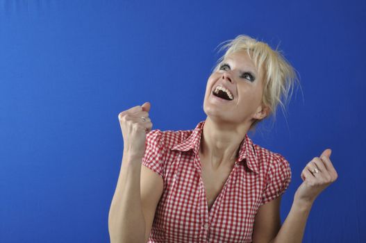 Successful woman with arms up 