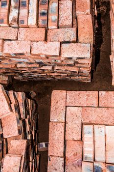 A top view of stacked bricks, ready for the builder to use on compelting the new house.