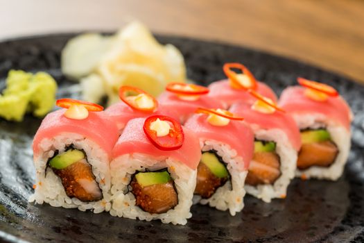 Maki Sushi. Roll with Cucumber and Cream Cheese inside. Topped with Tuna