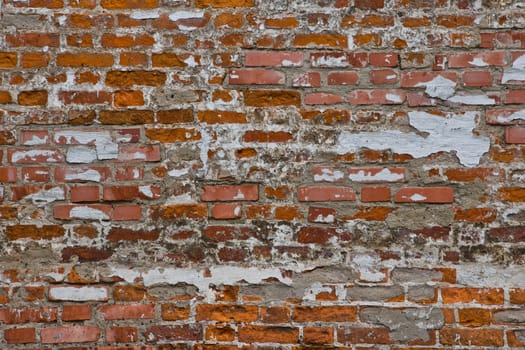 wall of red, white and orange bricks