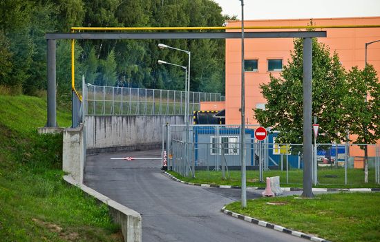 crossing guard at the entrance to the warehouse