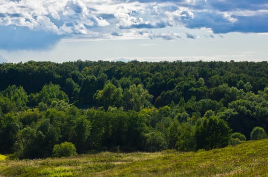 green valleys on a sunny day with beautiful clouds