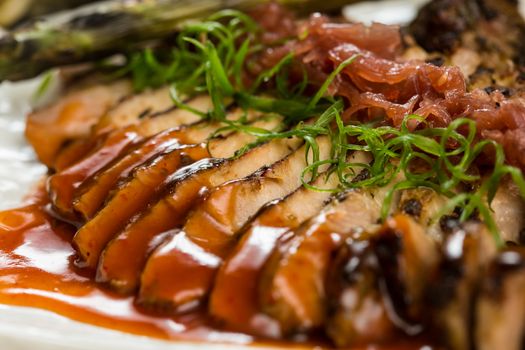 Roast pork loin with pickled onions and spices