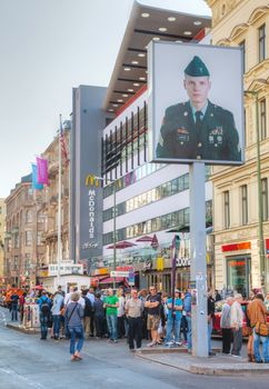 BERLIN - OCTOBER 4, 2014: Checkpoint Charlie on October 4, 2014 in Berlin, Germany. The name was given by the Western Allies to the best-known Berlin Wall crossing point between East and West Berlin during the Cold War.