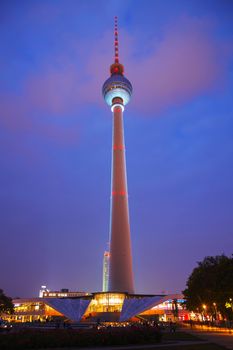 BERLIN - OCTOBER 2, 2014: Alexanderplatz at night on October 2, 2014 in Berlin, Germany. It's a large public square and transport hub in the central Mitte district of Berlin, near the Fernsehturm.