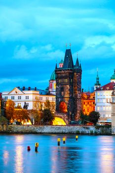 The Old Town with Charles bridge tower in Prague in the evening