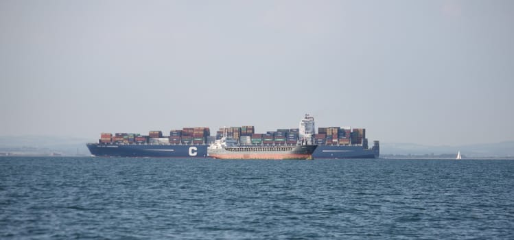 cargo ships passing at sea
