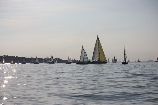 yacht sailboats sailing on a calm sunny day on the solent