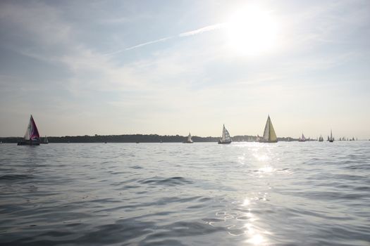 yacht sailboats sailing on a calm sunny day on the solent