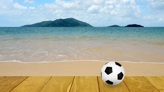 Football at the beach with island background