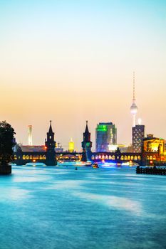 Berlin cityscape with Oberbaum bridge in the evening