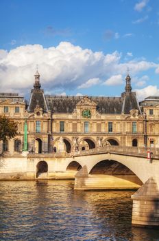 The Louvre palace in Paris, France on a cloudy day