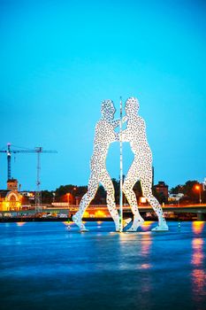 BERLIN - OCTOBER 4, 2014: Molecul Man sculpture on October 4, 2014 in Berlin, Germany. It's one in a series of aluminium sculptures, designed by American artist Jonathan Borofsky, installed at various locations in the world, including Berlin.