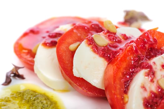 Caprese antipasto salad with mozarella cheese, tomatoes, isolated on white