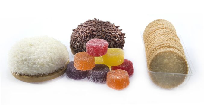 collection of delicious candies, biscuit and Cookies on a white background .