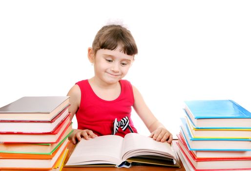 Cheerful Little Girl with the Books at the Desk on the White Background