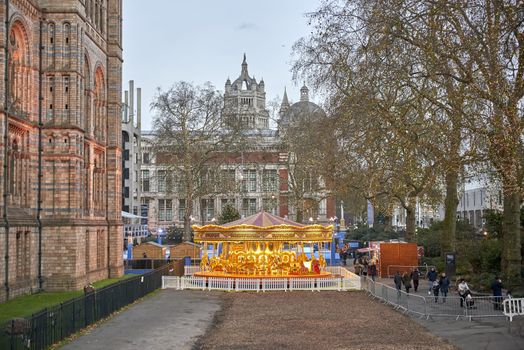 LONDON, UK - DECEMBER 11: Traditional Victorian carousel in the courtyard of the Natural History Museum. December 11, 2014 in London. 