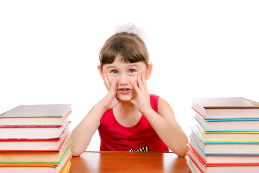 Little Girl with the Books at the Desk on the White Background