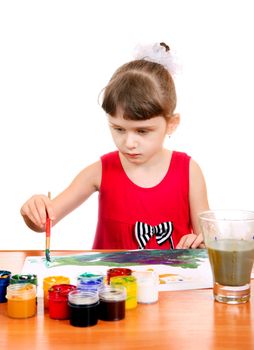 Concentrated Little Girl Drawing Isolated on the white background