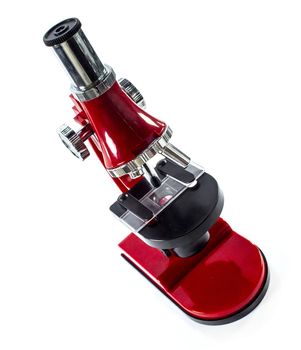 Modern red Microscope isolated on white background