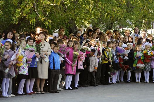 Pupils of elementary school on a solemn ruler on September 1 in the school yard