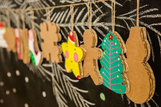 Cardboard toys for the Christmas tree or Christmas garland. Christmas decorations. Selective Focus