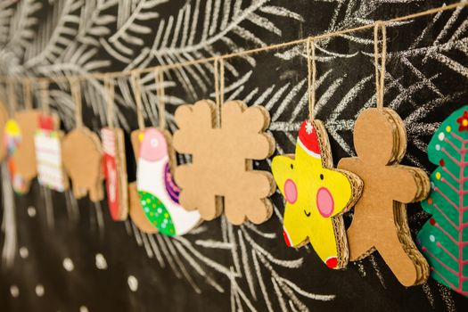 Cardboard toys for the Christmas tree or Christmas garland. Christmas decorations. Selective Focus