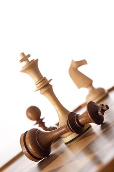 chess game - white king standing over black king - checkmate
