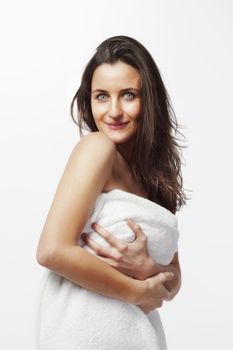 brunette with long hair in white towel isolated on white background