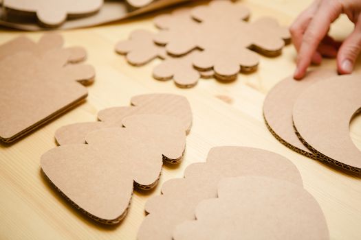 Cardboard toys for the Christmas tree or Christmas garland. Christmas decorations. Selective Focus