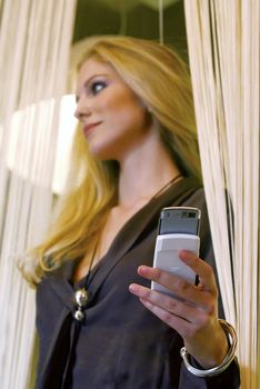 happy young businesswoman talking on mobile phone