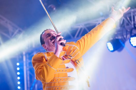 Yateley, UK - June 30, 2012: Professional Freddie Mercury tribute artist Steve Littlewood performing at the GOTG Festival in Yateley, UK