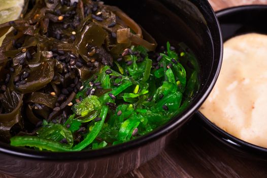 asian seaweed salad in bowl with nut sauce 