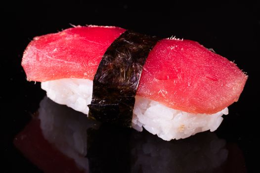 tuna nigiri Maguro isolated on black background