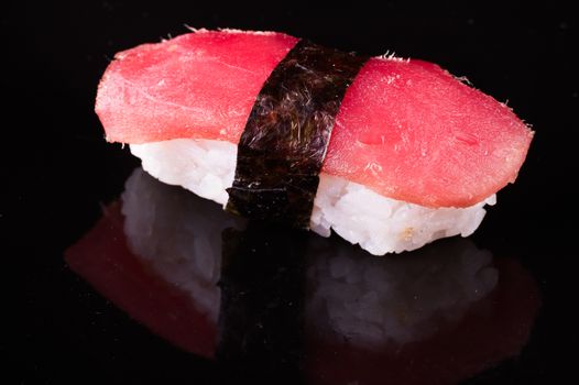 tuna nigiri Maguro isolated on black background