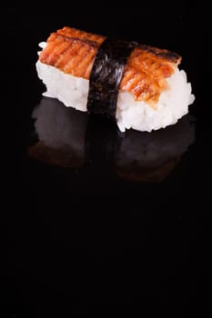 eel nigiri isolated on isolated black background 