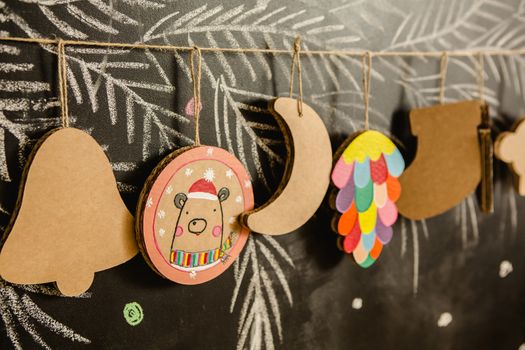 Cardboard toys for the Christmas tree or Christmas garland. Christmas decorations. Selective Focus