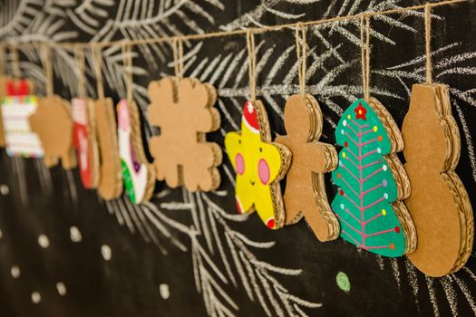 Cardboard toys for the Christmas tree or Christmas garland. Christmas decorations. Selective Focus