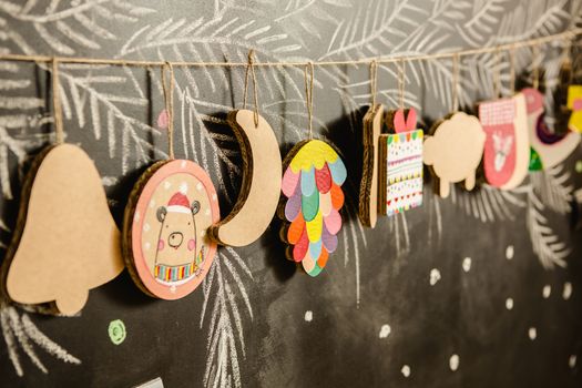 Cardboard toys for the Christmas tree or Christmas garland. Christmas decorations. Selective Focus