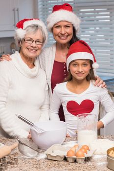 Multi-generation family baking together at home in the kitchen