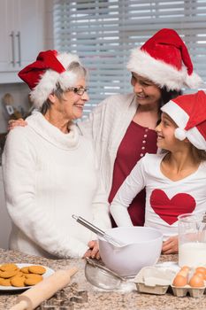 Multi-generation family baking together at home in the kitchen