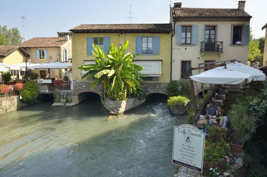 Restaurants on the banks of the river Mincio in Borguetto, an ancient village  in the municipality of Valeggio, in the province of Verona, Italy.