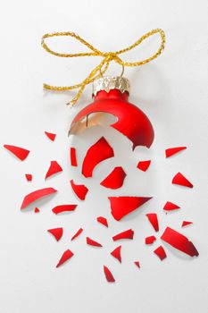 Broken Red Christmas tree ball isolated 