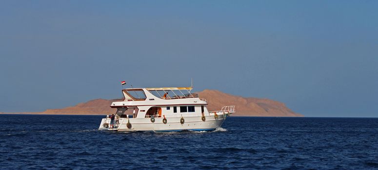 White Ship Moving By The Red Sea