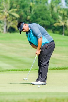 CHONBURI - DECEMBER 13 : Kiradech Aphibarnrat of Thailand  player in Thailand Golf Championship 2014 (Professional golf tournament on the Asian Tour) at Amata Spring Country Club on December 13, 2014 in Chonburi, Thailand.