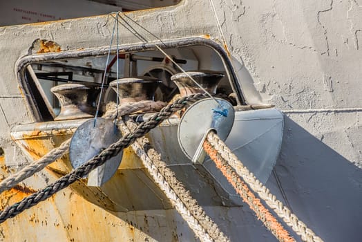 Capstans in an opening of the gunwale of a ship on the rope deck for the ropes to be secured while docking.