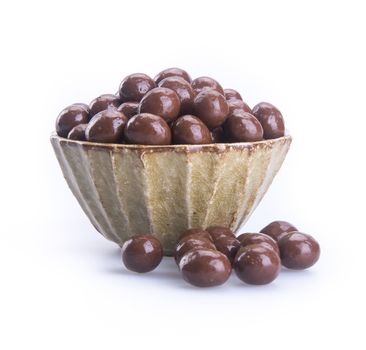 chocolate balls. chocolate balls in bowl on a background.