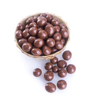 chocolate balls. chocolate balls in bowl on a background.