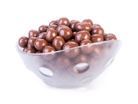 chocolate balls. chocolate balls in bowl on a background.