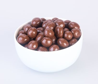 chocolate balls. chocolate balls in bowl on a background.